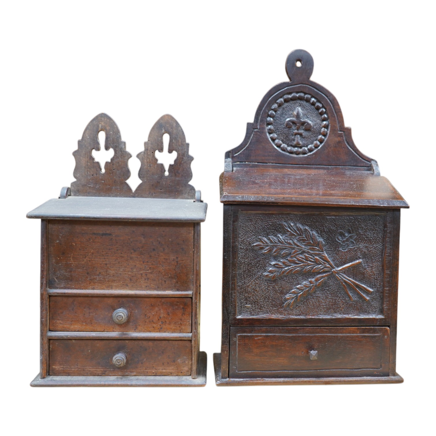 Two 19th century carved beech salt boxes, largest 40cm high. Condition - fair